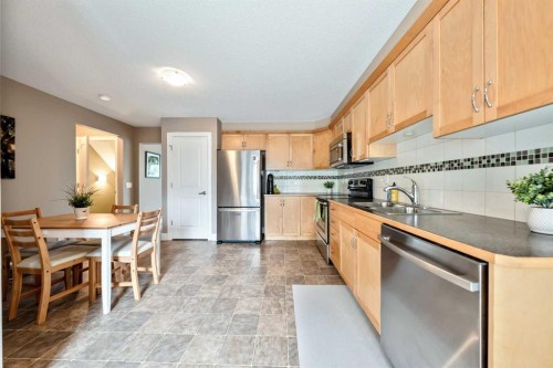 1333 Windstone Road Sw, Airdrie, AB - Indoor Photo Showing Kitchen With Double Sink