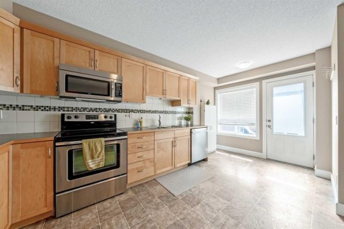 1333 Windstone Road Sw, Airdrie, AB - Indoor Photo Showing Kitchen With Stainless Steel Kitchen