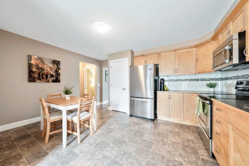 1333 Windstone Road Sw, Airdrie, AB - Indoor Photo Showing Kitchen With Stainless Steel Kitchen