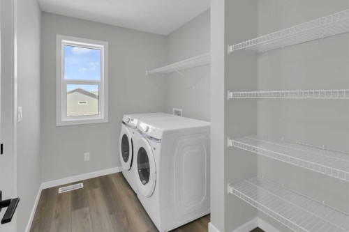 172 Starling Place Nw, Calgary, AB - Indoor Photo Showing Laundry Room