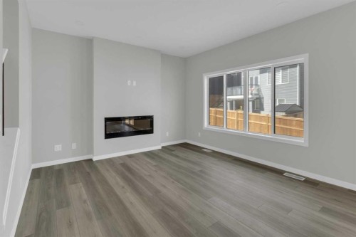 172 Starling Place Nw, Calgary, AB - Indoor Photo Showing Living Room With Fireplace