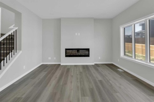 172 Starling Place Nw, Calgary, AB - Indoor Photo Showing Living Room With Fireplace