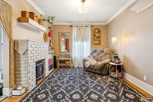 831 4A Street Ne, Calgary, AB - Indoor With Fireplace