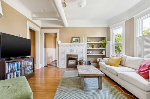 831 4A Street Ne, Calgary, AB - Indoor Photo Showing Living Room With Fireplace