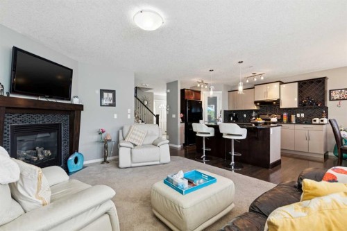768 New Brighton Drive Se, Calgary, AB - Indoor Photo Showing Living Room With Fireplace