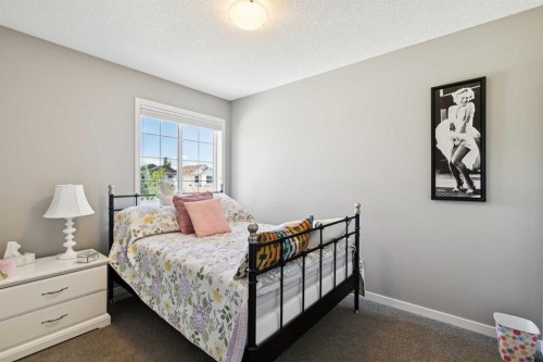 768 New Brighton Drive Se, Calgary, AB - Indoor Photo Showing Bedroom