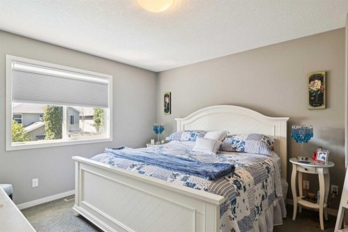 768 New Brighton Drive Se, Calgary, AB - Indoor Photo Showing Bedroom