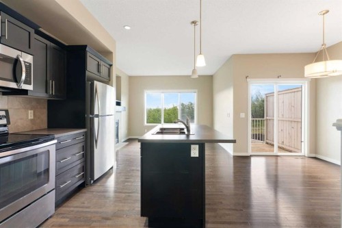 638 River Heights Crescent, Cochrane, AB - Indoor Photo Showing Kitchen With Double Sink With Upgraded Kitchen