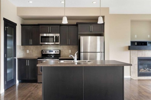 638 River Heights Crescent, Cochrane, AB - Indoor Photo Showing Kitchen With Double Sink With Upgraded Kitchen