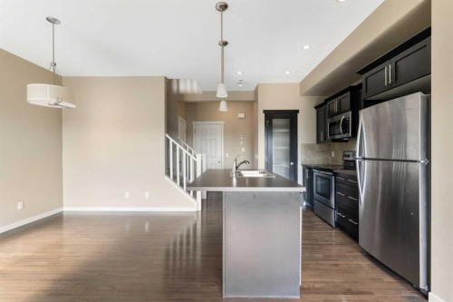 638 River Heights Crescent, Cochrane, AB - Indoor Photo Showing Kitchen With Upgraded Kitchen