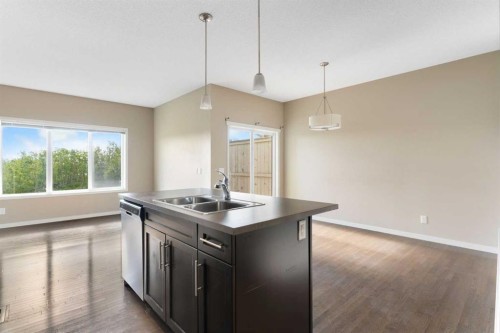 638 River Heights Crescent, Cochrane, AB - Indoor Photo Showing Kitchen With Double Sink
