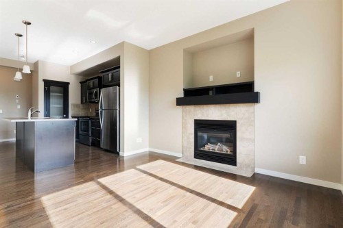 638 River Heights Crescent, Cochrane, AB - Indoor Photo Showing Living Room With Fireplace
