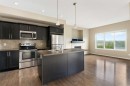 638 River Heights Crescent, Cochrane, AB  - Indoor Photo Showing Kitchen With Double Sink With Upgraded Kitchen 
