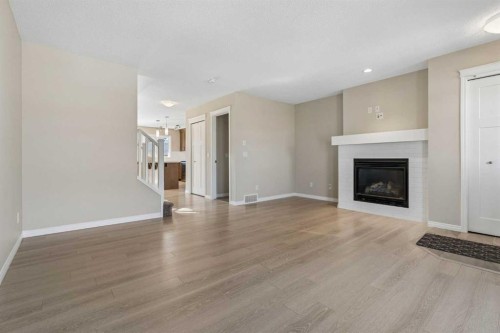 229 Fireside Drive, Cochrane, AB - Indoor Photo Showing Living Room With Fireplace