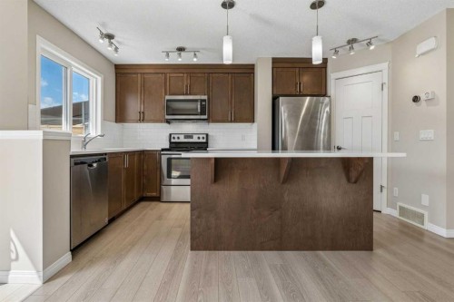 229 Fireside Drive, Cochrane, AB - Indoor Photo Showing Kitchen With Stainless Steel Kitchen With Upgraded Kitchen