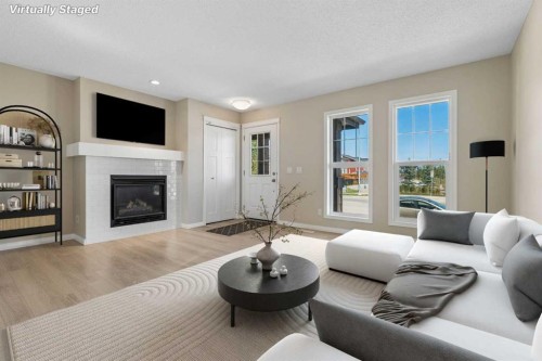 229 Fireside Drive, Cochrane, AB - Indoor Photo Showing Living Room With Fireplace