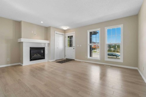 229 Fireside Drive, Cochrane, AB - Indoor Photo Showing Living Room With Fireplace