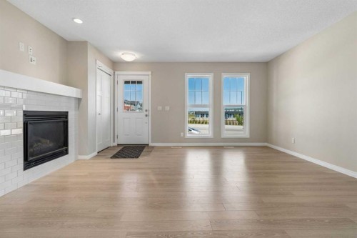 229 Fireside Drive, Cochrane, AB - Indoor Photo Showing Living Room With Fireplace