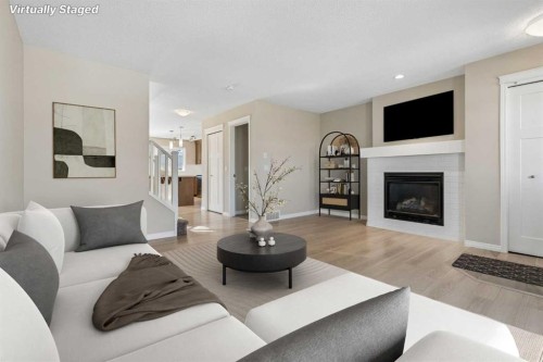 229 Fireside Drive, Cochrane, AB - Indoor Photo Showing Living Room With Fireplace