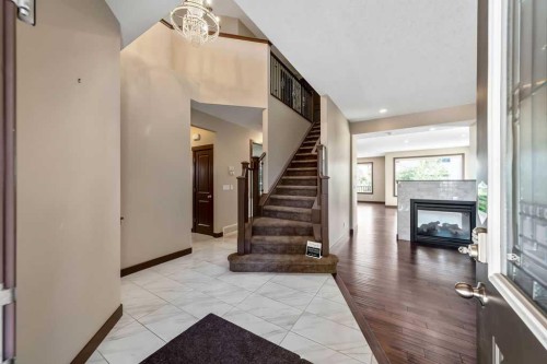 183 Cranford Green Se, Calgary, AB - Indoor Photo Showing Other Room With Fireplace