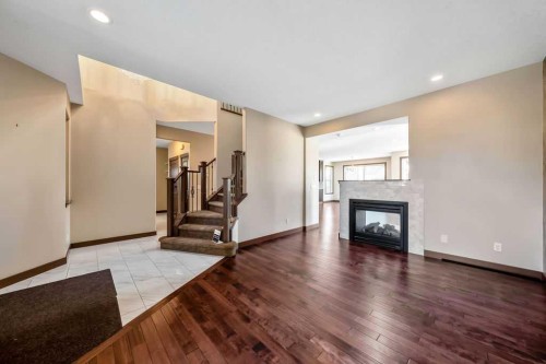 183 Cranford Green Se, Calgary, AB - Indoor Photo Showing Living Room With Fireplace