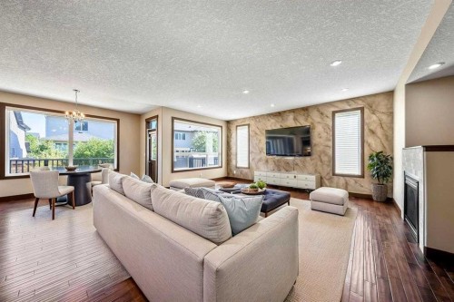 183 Cranford Green Se, Calgary, AB - Indoor Photo Showing Living Room With Fireplace