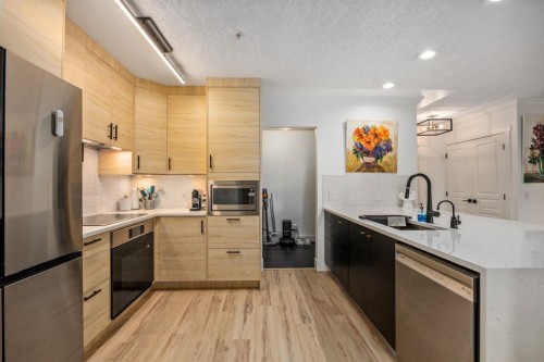 106-59 22 Avenue Sw, Calgary, AB - Indoor Photo Showing Kitchen With Stainless Steel Kitchen With Upgraded Kitchen