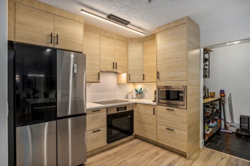 106-59 22 Avenue Sw, Calgary, AB - Indoor Photo Showing Kitchen With Stainless Steel Kitchen