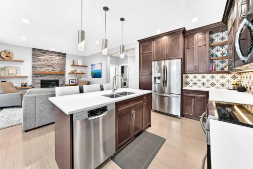 152 Royal Oak Terrace Nw, Calgary, AB - Indoor Photo Showing Kitchen With Fireplace With Double Sink With Upgraded Kitchen