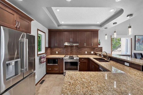 31 Scenic Cove Place Nw, Calgary, AB - Indoor Photo Showing Kitchen With Double Sink With Upgraded Kitchen