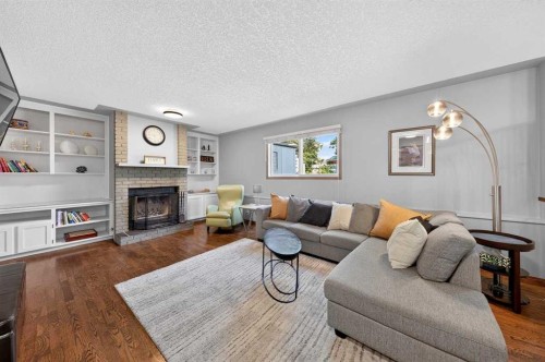 31 Scenic Cove Place Nw, Calgary, AB - Indoor Photo Showing Living Room With Fireplace