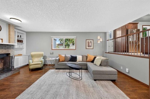 31 Scenic Cove Place Nw, Calgary, AB - Indoor Photo Showing Living Room With Fireplace