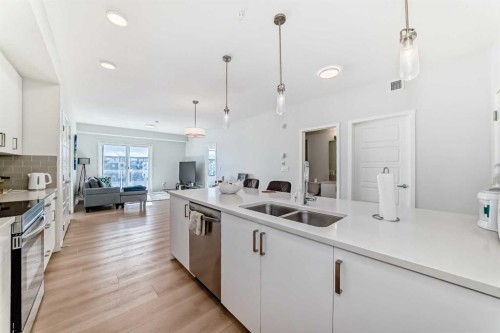4414-550 Belmont Street Sw, Calgary, AB - Indoor Photo Showing Kitchen With Double Sink With Upgraded Kitchen