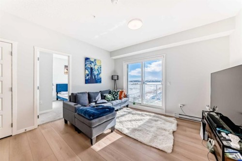4414-550 Belmont Street Sw, Calgary, AB - Indoor Photo Showing Living Room