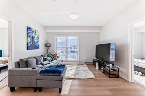 4414-550 Belmont Street Sw, Calgary, AB - Indoor Photo Showing Living Room With Fireplace