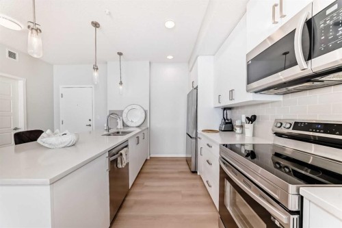 4414-550 Belmont Street Sw, Calgary, AB - Indoor Photo Showing Kitchen With Stainless Steel Kitchen With Double Sink With Upgraded Kitchen