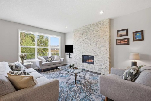 190 Riviera View, Cochrane, AB - Indoor Photo Showing Living Room With Fireplace