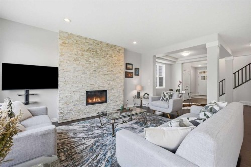 190 Riviera View, Cochrane, AB - Indoor Photo Showing Living Room With Fireplace