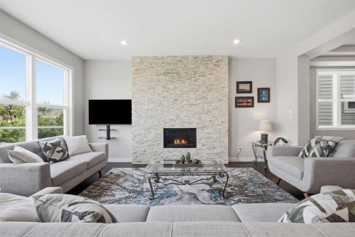 190 Riviera View, Cochrane, AB - Indoor Photo Showing Living Room With Fireplace