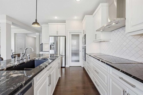 190 Riviera View, Cochrane, AB - Indoor Photo Showing Kitchen With Stainless Steel Kitchen With Double Sink With Upgraded Kitchen