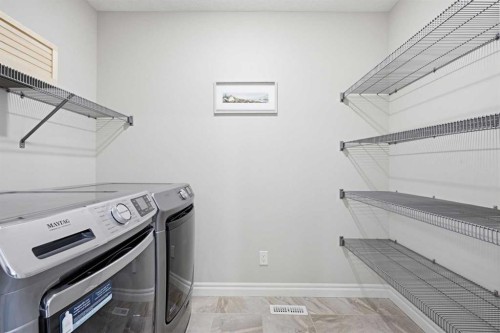 190 Riviera View, Cochrane, AB - Indoor Photo Showing Laundry Room