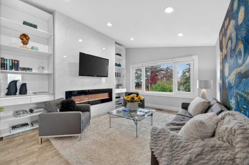 11 Selkirk Drive Sw, Calgary, AB - Indoor Photo Showing Living Room With Fireplace