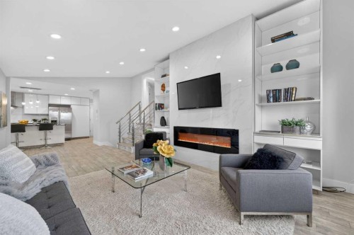 11 Selkirk Drive Sw, Calgary, AB - Indoor Photo Showing Living Room With Fireplace