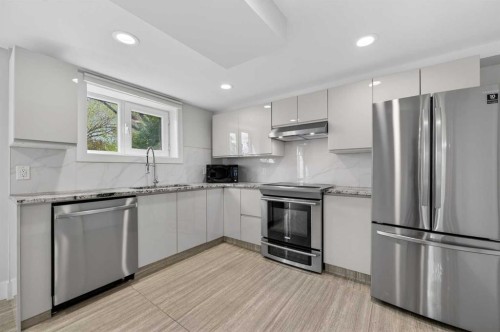 11 Selkirk Drive Sw, Calgary, AB - Indoor Photo Showing Kitchen With Stainless Steel Kitchen