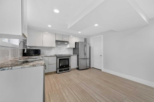11 Selkirk Drive Sw, Calgary, AB - Indoor Photo Showing Kitchen With Stainless Steel Kitchen With Upgraded Kitchen
