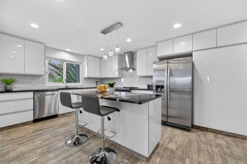 11 Selkirk Drive Sw, Calgary, AB - Indoor Photo Showing Kitchen With Stainless Steel Kitchen With Upgraded Kitchen