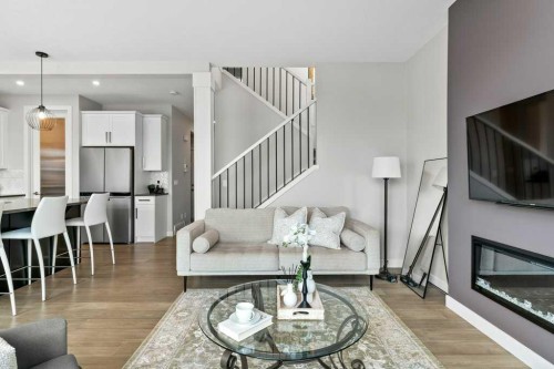 363 Precedence Hill, Cochrane, AB - Indoor Photo Showing Living Room With Fireplace