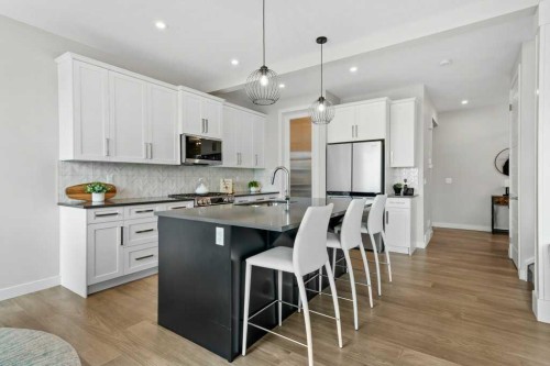 363 Precedence Hill, Cochrane, AB - Indoor Photo Showing Kitchen With Upgraded Kitchen