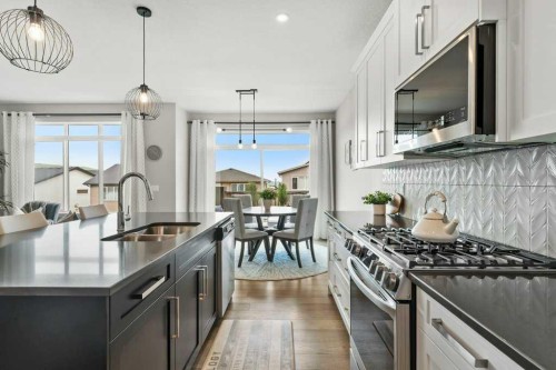 363 Precedence Hill, Cochrane, AB - Indoor Photo Showing Kitchen With Double Sink With Upgraded Kitchen