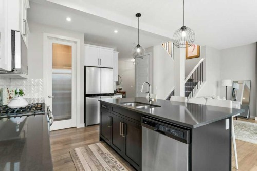 363 Precedence Hill, Cochrane, AB - Indoor Photo Showing Kitchen With Stainless Steel Kitchen With Double Sink With Upgraded Kitchen